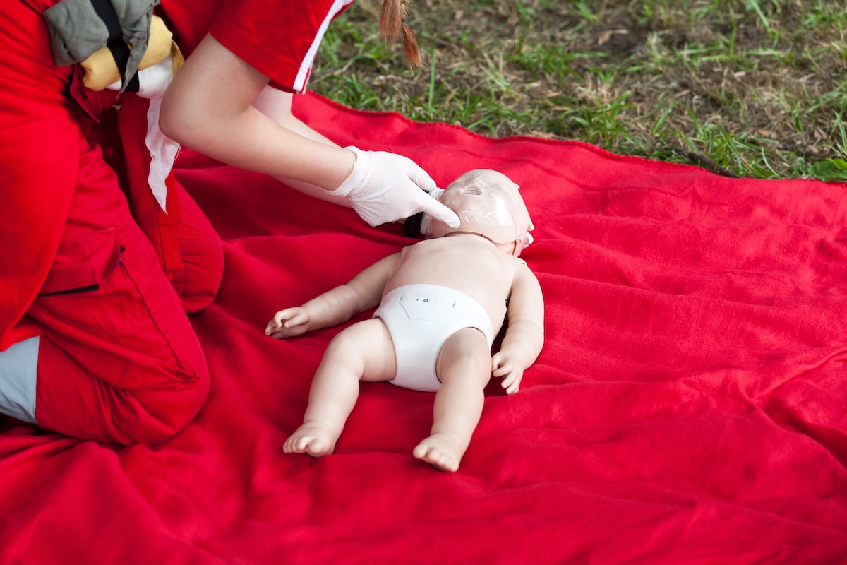 Pediatric CPR training demonstration on an infant mannequin for parents in Cary, NC